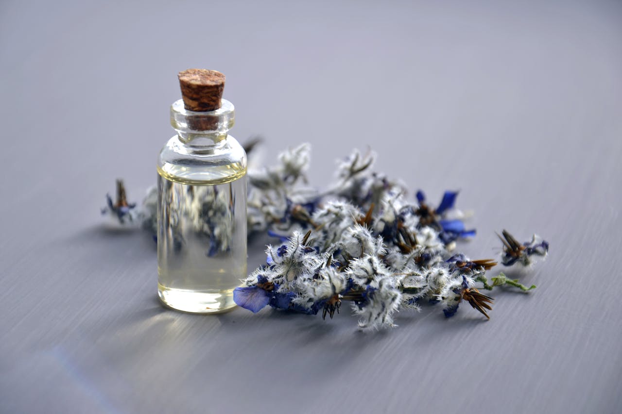 who-we-are Close-up of a lavender oil bottle with dried flowers for aromatherapy. Perfect for wellness themes.